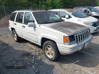1998 Jeep Grand Cherokee with VIN 1J4FX78S8WC198123, listed as a IAAI auction lot 42102323 with 90,894 mi miles and . Bid and sale history available at DreamBid. Image 1.