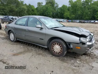 1999 Mercury Sable LS with VIN 1MEFM53U6XG646248, listed as a Copart auction lot 57859405 with 128,286 mi miles and Salvage title. Bid and sale history available at DreamBid. Image 4.