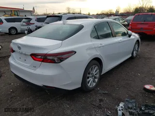 2024 Toyota Camry LE with VIN 4T1C11AK5RU899617, listed as a IAAI auction lot 41810634 with 24,295 mi miles. Bid and sale history available at carsss.com. Image 4.