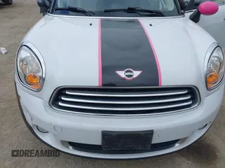 2014 MINI Countryman with VIN WMWZB3C5XEWR37594, listed as a IAAI auction lot 42500466 with 67,589 mi miles and . Bid and sale history available at DreamBid. Image 6.
