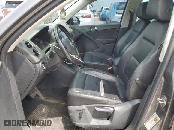 2012 Volkswagen Tiguan SE z VIN WVGAV7AX4CW001417, wystawiony jako Copart lot #61105865 z przebiegiem 168 110 mil mil oraz Czysty tytuł • Clean title. Historia ofert i sprzedaży dostępna na DreamBid. Obrazek 7.