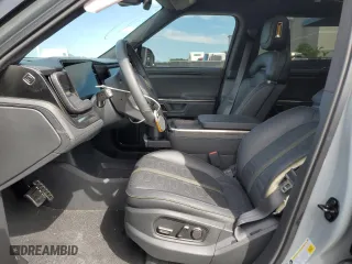 2024 Rivian R1S Adventure with VIN 7PDSGABA1RN031380, listed as a Copart auction lot 73119354 with 6,786 mi miles and Salvage Title. Bid and sale history available at carsss.com. Image 7.