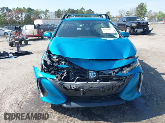 2021 Toyota Prius LE with VIN JTDKAMFP7M3180504, listed as a IAAI auction lot 41985409 with 56,617 mi miles and . Bid and sale history available at DreamBid. Image 12.