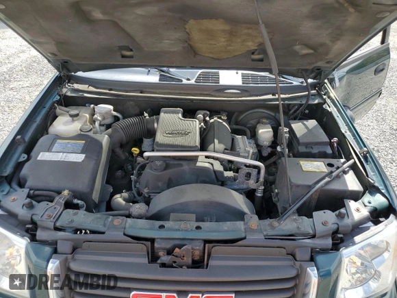 2005 GMC Envoy SLT with VIN 1GKDT13S952144349, listed as a Copart auction lot 71800694 with 137,614 mi miles and Salvage Title. Bid and sale history available at DreamBid. Image 12.