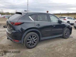 2017 Mazda CX-5 Grand Touring with VIN JM3KFBDL7H0204658, listed as a Copart auction lot 54007165 with 154,546 mi miles and Salvage Title. Bid and sale history available at carsss.com. Image 3.