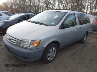 2003 Toyota Sienna CE with VIN 4T3ZF19C43U509873, listed as a IAAI auction lot 41784526 with 999,999 mi miles. Bid and sale history available at carsss.com. Image 2.