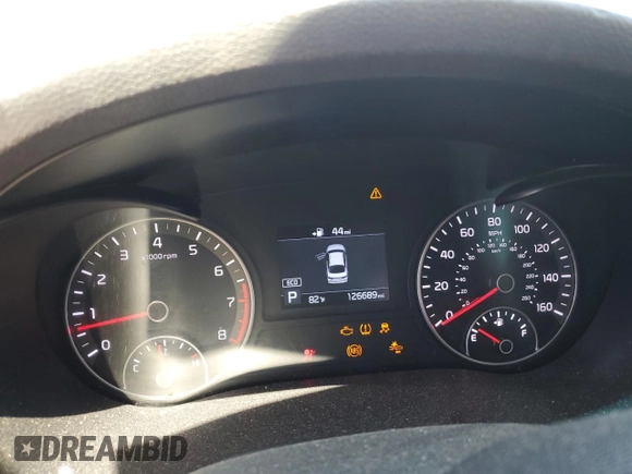 2019 Kia Optima LX z VIN 5XXGT4L31KG289703, wystawiony jako Copart lot #57663005 z przebiegiem 126 689 mil mil oraz Szkoda całkowita • Salvage title. Historia ofert i sprzedaży dostępna na DreamBid. Obrazek 9.