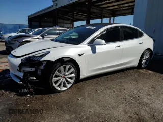 2020 Tesla Model 3 Standard Range Plus with VIN 5YJ3E1EA6LF661513, listed as a Copart auction lot 47008985 with 128,362 mi miles and Non Repairable. Bid and sale history available at DreamBid. Image 1.