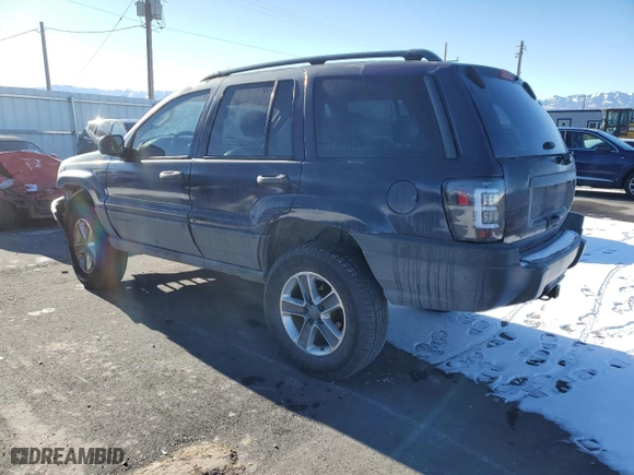 2004 Jeep Grand Cherokee Laredo with VIN 1J4GW48S44C325808, listed as a Copart auction lot 89351575 with 312,011 mi miles and Salvage Title. Bid and sale history available at carsss.com. Image 2.