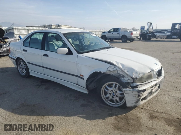 1998 BMW 3 Series 328iA with VIN WBACD4324WAV61646, listed as a Copart auction lot 43607845 with 253,609 mi miles and Salvage Title. Bid and sale history available at carsss.com. Image 4.