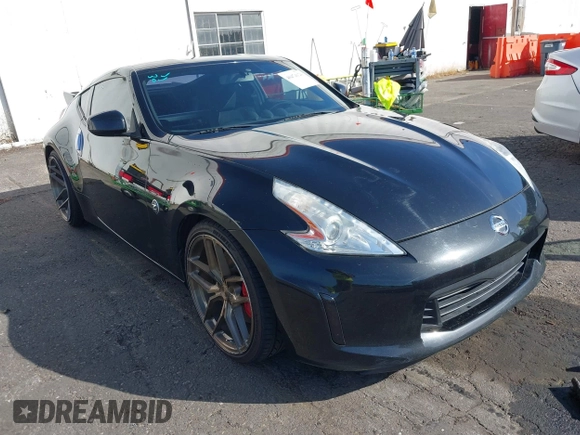 2013 Nissan 370Z z VIN JN1AZ4EH1DM880739, wystawiony jako IAAI lot #40474120 z przebiegiem 76 369 mil mil oraz . Historia ofert i sprzedaży dostępna na DreamBid. Obrazek 1.