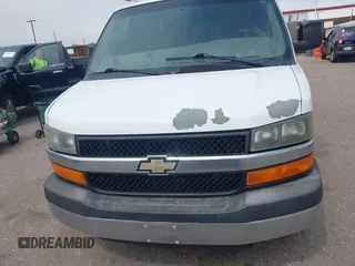 2012 Chevrolet Express Cargo Van with VIN 1GCWGFCA7C1121989, listed as a IAAI auction lot 42118853 with 214,478 mi miles. Bid and sale history available at carsss.com. Image 6.