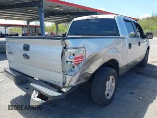 2013 Ford F-150 XL with VIN 1FTEW1CM2DFA62107, listed as a IAAI auction lot 41873021 with 149,648 mi miles and . Bid and sale history available at carsss.com. Image 4.