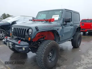 2013 Jeep Wrangler Rubicon 10th Anniversary with VIN 1C4BJWCG2DL651815, listed as a IAAI auction lot 41643919 with 98,297 mi miles and . Bid and sale history available at DreamBid. Image 17.