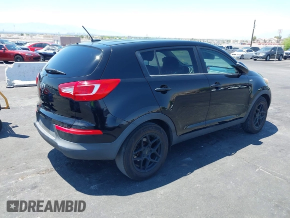 2013 Kia Sportage LX with VIN KNDPBCA25D7449584, listed as a IAAI auction lot 42489414 with 100,993 mi miles and . Bid and sale history available at DreamBid. Image 4.