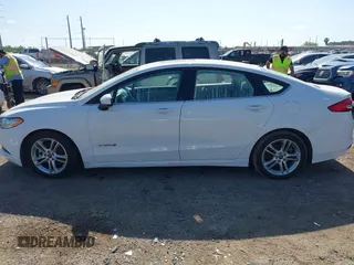 2018 Ford Fusion SE z VIN 3FA6P0LU2JR155483, wystawiony jako IAAI lot #42019475 z przebiegiem Nie podano mil oraz . Historia ofert i sprzedaży dostępna na DreamBid. Obrazek 14.
