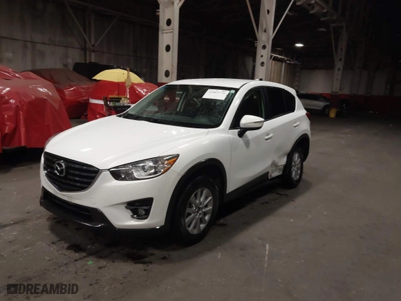2016 Mazda CX-5 Touring with VIN JM3KE4CY0G0853261, listed as a IAAI auction lot 41861176 with 63,491 mi miles. Bid and sale history available at carsss.com. Image 2.