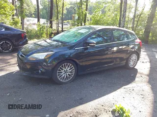 2014 Ford Focus Titanium z VIN 1FADP3N28EL166187, wystawiony jako IAAI lot #42553868 z przebiegiem 189 470 mil mil oraz . Historia ofert i sprzedaży dostępna na DreamBid. Obrazek 2.