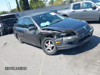 2002 Mitsubishi Lancer OZ-Rally z VIN JA3AJ86E62U047174, wystawiony jako IAAI lot #41866750 z przebiegiem 166 119 mil mil oraz . Historia ofert i sprzedaży dostępna na DreamBid. Obrazek 1.
