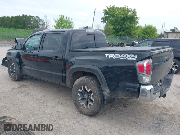 2023 Toyota Tacoma SR with VIN 3TMCZ5AN2PM598464, listed as a IAAI auction lot 42238032 with 35,597 mi miles and . Bid and sale history available at DreamBid. Image 3.