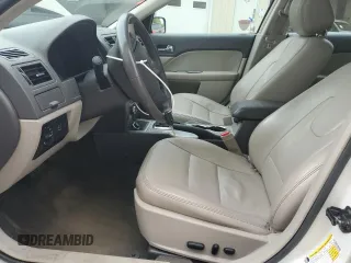 2012 Ford Fusion Hybrid with VIN 3FADP0L34CR414234, listed as a Copart auction lot 58891715 with 147,409 mi miles and Salvage title. Bid and sale history available at DreamBid. Image 7.
