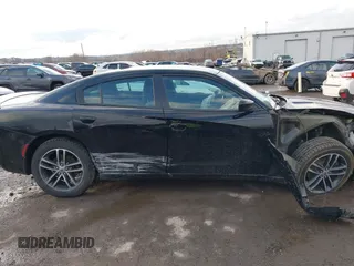 2019 Dodge Charger SXT with VIN 2C3CDXJG3KH630975, listed as a IAAI auction lot 41580174 with 74,575 mi miles and . Bid and sale history available at DreamBid. Image 13.