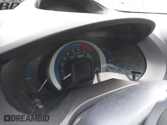 2010 Honda Insight EX with VIN JHMZE2H77AS022538, listed as a IAAI auction lot 41804579 with 184,000 mi miles and . Bid and sale history available at DreamBid. Image 7.