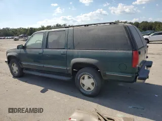 1998 GMC Suburban z VIN 3GKFK16R1WG511256, wystawiony jako Copart lot #77568484 z przebiegiem 301 116 mil mil oraz Czysty tytuł • Clean title. Historia ofert i sprzedaży dostępna na DreamBid. Obrazek 2.