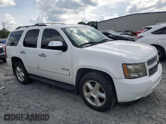2011 Chevrolet Tahoe LS with VIN 1GNSCAE08BR394917, listed as a Copart auction lot 60470395 with 143,824 mi miles and Salvage title. Bid and sale history available at DreamBid. Image 4.