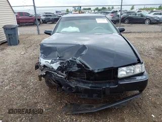 1994 Cadillac Seville STS z VIN 1G6KY5296RU823387, wystawiony jako IAAI lot #42151901 z przebiegiem 165 918 mil mil oraz . Historia ofert i sprzedaży dostępna na DreamBid. Obrazek 13.