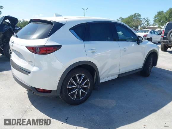 2018 Mazda CX-5 Grand Touring with VIN JM3KFADM2J1422512, listed as a IAAI auction lot 42010801 with 48,567 mi miles and . Bid and sale history available at DreamBid. Image 4.