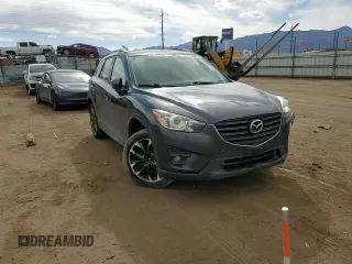 2016 Mazda CX-5 Grand Touring z VIN JM3KE4DY0G0633861, wystawiony jako Copart lot #47748645 z przebiegiem 112 219 mil mil oraz Szkoda całkowita • Salvage title. Historia ofert i sprzedaży dostępna na DreamBid. Obrazek 11.