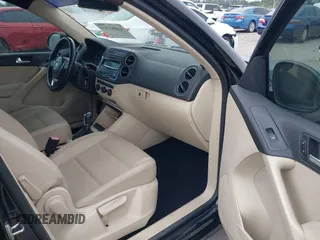 2014 Volkswagen Tiguan SE z VIN WVGAV3AXXEW535128, wystawiony jako IAAI lot #41882213 z przebiegiem 103 161 mil mil oraz . Historia ofert i sprzedaży dostępna na DreamBid. Obrazek 5.