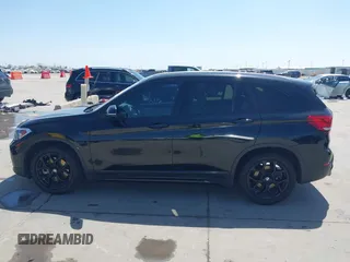 2021 BMW X1 sDrive28i with VIN WBXJG7C07M3M65841, listed as a IAAI auction lot 41877032 with 79,817 mi miles and . Bid and sale history available at DreamBid. Image 14.