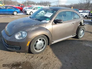 2012 Volkswagen Beetle 2.5L PZEV with VIN 3VWJP7AT9CM609099, listed as a IAAI auction lot 41396554 with 151,393 mi miles. Bid and sale history available at carsss.com. Image 2.