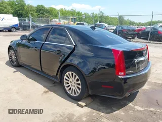 2011 Cadillac CTS Premium with VIN 1G6DS5ED4B0105859, listed as a IAAI auction lot 42494741 with 143,128 mi miles and . Bid and sale history available at DreamBid. Image 3.