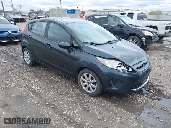 2011 Ford Fiesta SE with VIN 3FADP4EJ4BM228417, listed as a IAAI auction lot 42061494 with 86,873 mi miles. Bid and sale history available at carsss.com. Image 1.