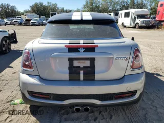2014 MINI Coupe S z VIN WMWSX3C57ET409158, wystawiony jako Copart lot #81650034 z przebiegiem 118 523 mil mil oraz Szkody całkowita. Historia ofert i sprzedaży dostępna na DreamBid. Obrazek 6.