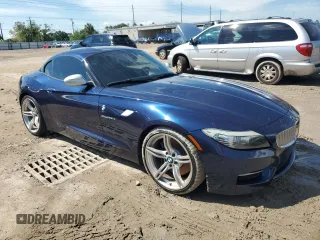 2011 BMW Z4 sDrive35is with VIN WBALM1C56BE393858, listed as a Copart auction lot 74249954 with 0 mi miles and Salvage Title. Bid and sale history available at carsss.com. Image 4.