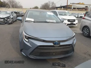 2023 Toyota Corolla Hybrid LE with VIN JTDBCMFE0P3023071, listed as a IAAI auction lot 41273943 with 26,250 mi miles. Bid and sale history available at carsss.com. Image 12.