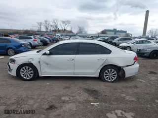 2014 Volkswagen Passat Wolfsburg Ed with VIN 1VWAT7A38EC087906, listed as a IAAI auction lot 41623631 with 124,079 mi miles. Bid and sale history available at carsss.com. Image 6.