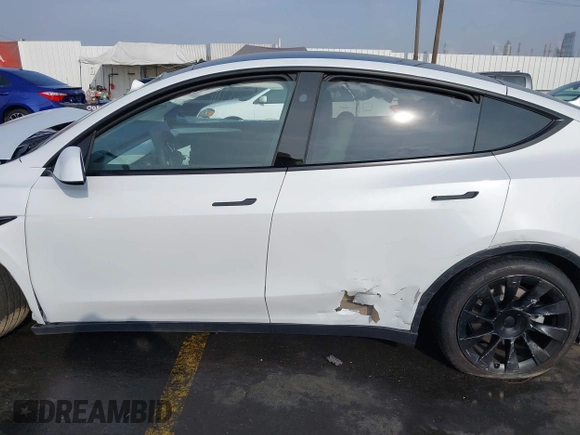 2023 Tesla Model Y Long Range with VIN 7SAYGDEE3PF900030, listed as a IAAI auction lot 41147192 with 13,903 mi miles and . Bid and sale history available at DreamBid. Image 13.
