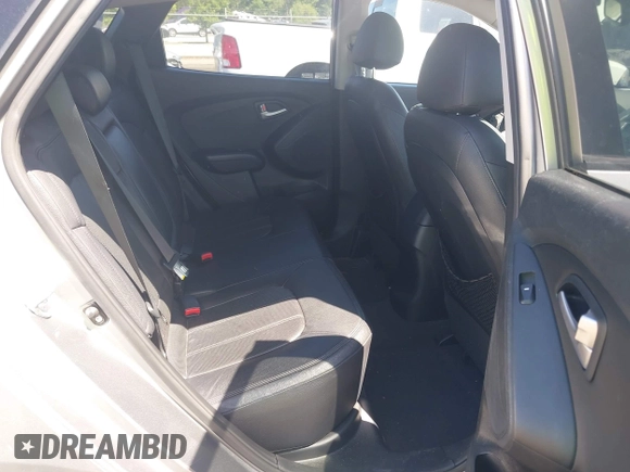 2013 Hyundai Tucson GLS with VIN KM8JU3AC4DU588062, listed as a IAAI auction lot 42080348 with 76,937 mi miles. Bid and sale history available at carsss.com. Image 8.