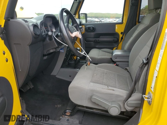 2009 Jeep Wrangler Unlimited Rubicon with VIN 1J8GA69109L761089, listed as a Copart auction lot 57975985 with 195,530 mi miles and Salvage title. Bid and sale history available at DreamBid. Image 7.