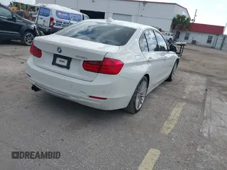 2012 BMW 3 Series 328i with VIN WBA3A5C57CF347953, listed as a IAAI auction lot 42176008 with 140,598 mi miles and . Bid and sale history available at carsss.com. Image 4.