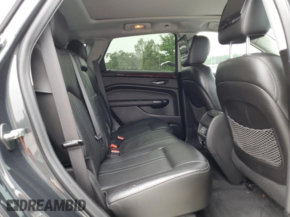 2015 Cadillac SRX Performance Collection with VIN 3GYFNCE38FS597717, listed as a Copart auction lot 57629615 with 102,689 mi miles and Salvage title. Bid and sale history available at DreamBid. Image 11.