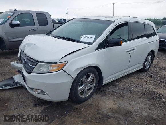 2012 Honda Odyssey Touring with VIN 5FNRL5H93CB034485, listed as a IAAI auction lot 42304502 with 198,589 mi miles and . Bid and sale history available at DreamBid. Image 17.