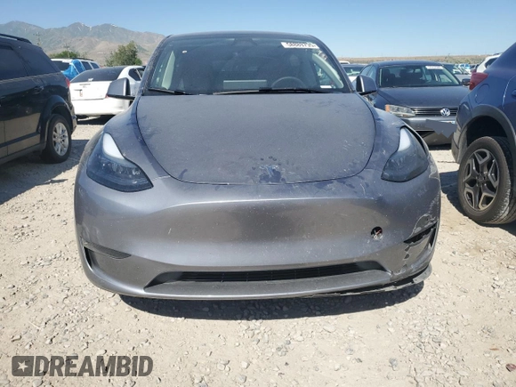 2024 Tesla Model Y Long Range with VIN 7SAYGDEE6RA321064, listed as a Copart auction lot 58889795 with 48,857 mi miles and Salvage title. Bid and sale history available at DreamBid. Image 5.