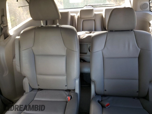 2014 Honda Odyssey Touring z VIN 5FNRL5H98EB512144, wystawiony jako Copart lot #69987533 z przebiegiem 184 231 mil mil oraz Szkoda całkowita • Salvage title. Historia ofert i sprzedaży dostępna na DreamBid. Obrazek 10.