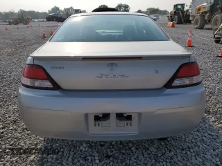 2000 Toyota Solara SE z VIN 2T1CF28P5YC267645, wystawiony jako Copart lot #60543605 z przebiegiem 58 938 mil mil oraz Szkoda całkowita • Salvage title. Historia ofert i sprzedaży dostępna na DreamBid. Obrazek 6.